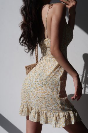 French-Style Yellow Floral V-Neck Tie Strap Dress with Waist-Cinching Short Skirt - Playful Vacation Essential