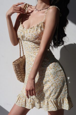 French-Style Yellow Floral V-Neck Tie Strap Dress with Waist-Cinching Short Skirt - Playful Vacation Essential