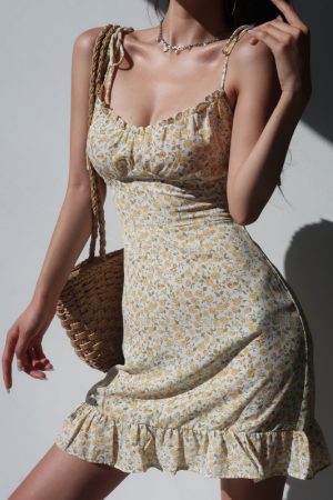 French-Style Yellow Floral V-Neck Tie Strap Dress with Waist-Cinching Short Skirt - Playful Vacation Essential