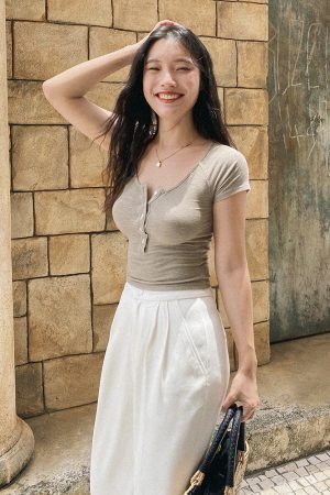 Slim-Fit White Knitted T-Shirt for Women, Short Sleeve with Button Detail, French Style, Chest-Highlighting Design