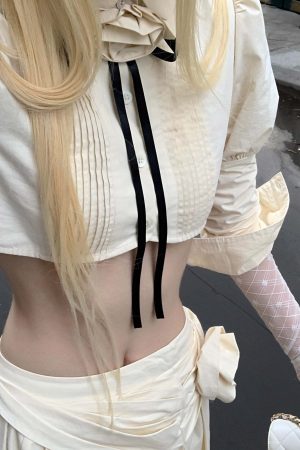 Rase le sol Cropped Puff-Sleeve Shirt with Pleated Front and Rosette Tie