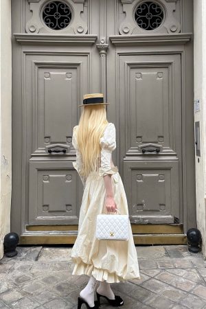 Rase le sol Cropped Puff-Sleeve Shirt with Pleated Front and Rosette Tie