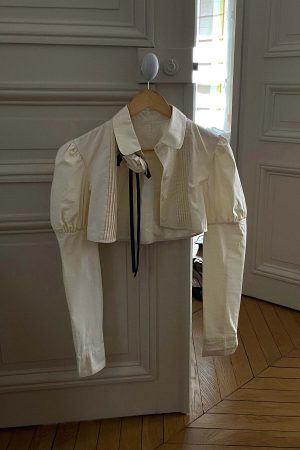 Rase le sol Cropped Puff-Sleeve Shirt with Pleated Front and Rosette Tie