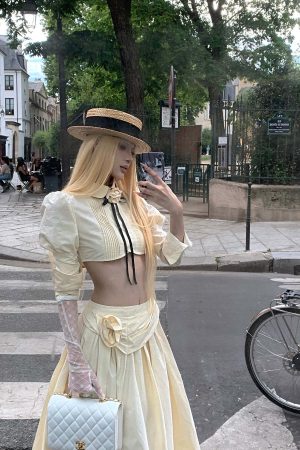 Rase le sol Cropped Puff-Sleeve Shirt with Pleated Front and Rosette Tie