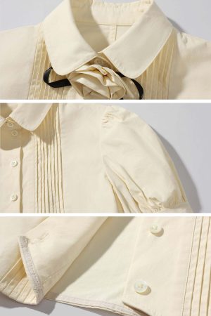 Rase le sol Cropped Puff-Sleeve Shirt with Pleated Front and Rosette Tie