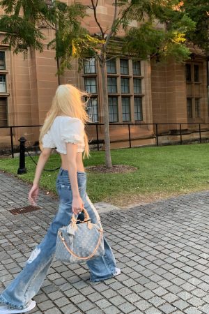 Rase le sol Distressed Wide-Leg Washed Denim Jeans