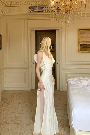 Rase le sol Draped Halter Backless Gown with Oversized Bow