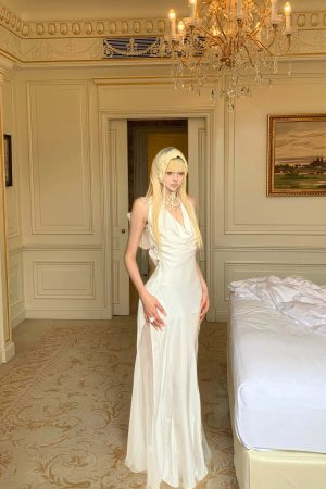 Rase le sol Draped Halter Backless Gown with Oversized Bow