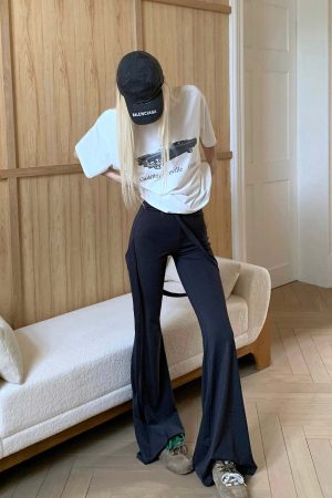Rase le sol High-Waisted Stretch Flared Pants with Asymmetric Wrap Tie Detail
