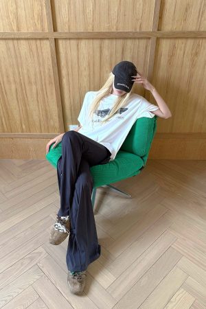 Rase le sol High-Waisted Stretch Flared Pants with Asymmetric Wrap Tie Detail