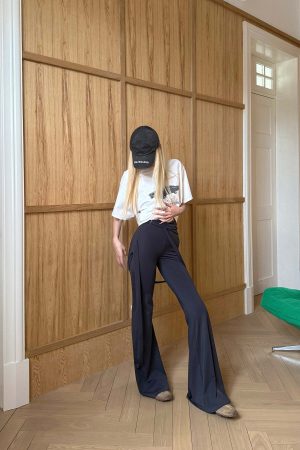 Rase le sol High-Waisted Stretch Flared Pants with Asymmetric Wrap Tie Detail