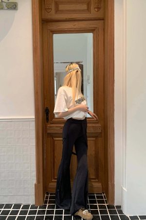 Rase le sol High-Waisted Stretch Flared Pants with Asymmetric Wrap Tie Detail