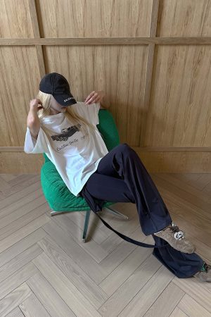 Rase le sol High-Waisted Stretch Flared Pants with Asymmetric Wrap Tie Detail