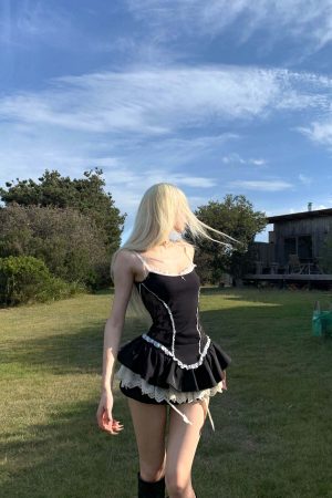 Rase le sol Lace-Trimmed Vest and Skirt Set with Cross Detail