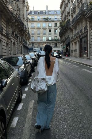 ROVENTE Draped Open Back Long Sleeve Top with Adjustable Strap