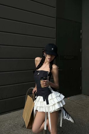 WARDEN EDGE Corset Dress with Tiered Pleated Hem and Side Lace-Up Detail