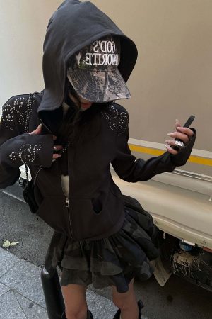 WARDEN EDGE Studded Zip-Up Hoodie with Spiral Embellishments and Extended Sleeves