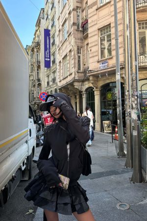 WARDEN EDGE Studded Zip-Up Hoodie with Spiral Embellishments and Extended Sleeves